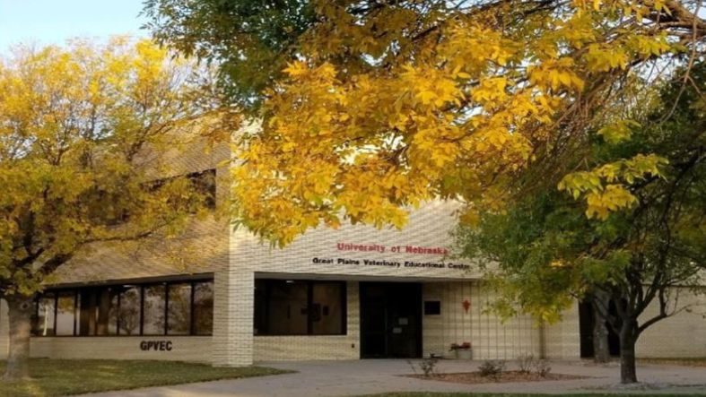 The entrance to the Great Plains Veterinary Educational Center during the fall when the leaves are changing to yellow.